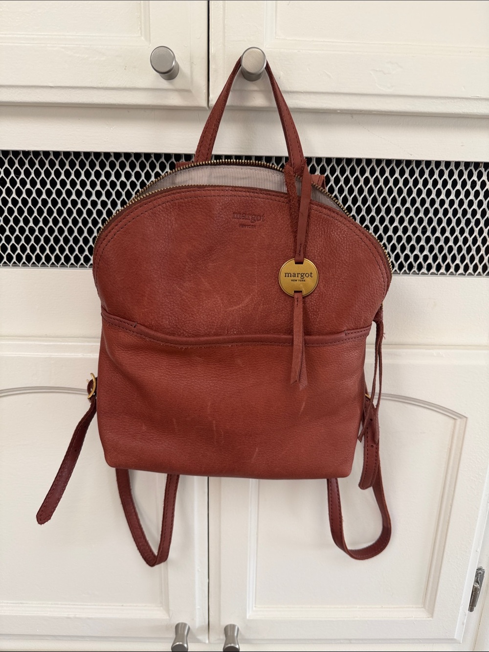 margot Rustic Red Pebbled Leather Backpack with Gold Logo Charm